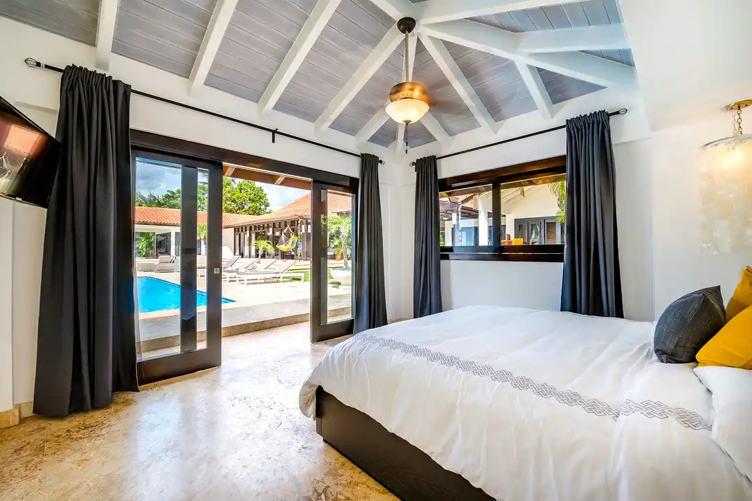 Bedroom at Costa Verde 3 opening straight onto the pool terrace and the sea