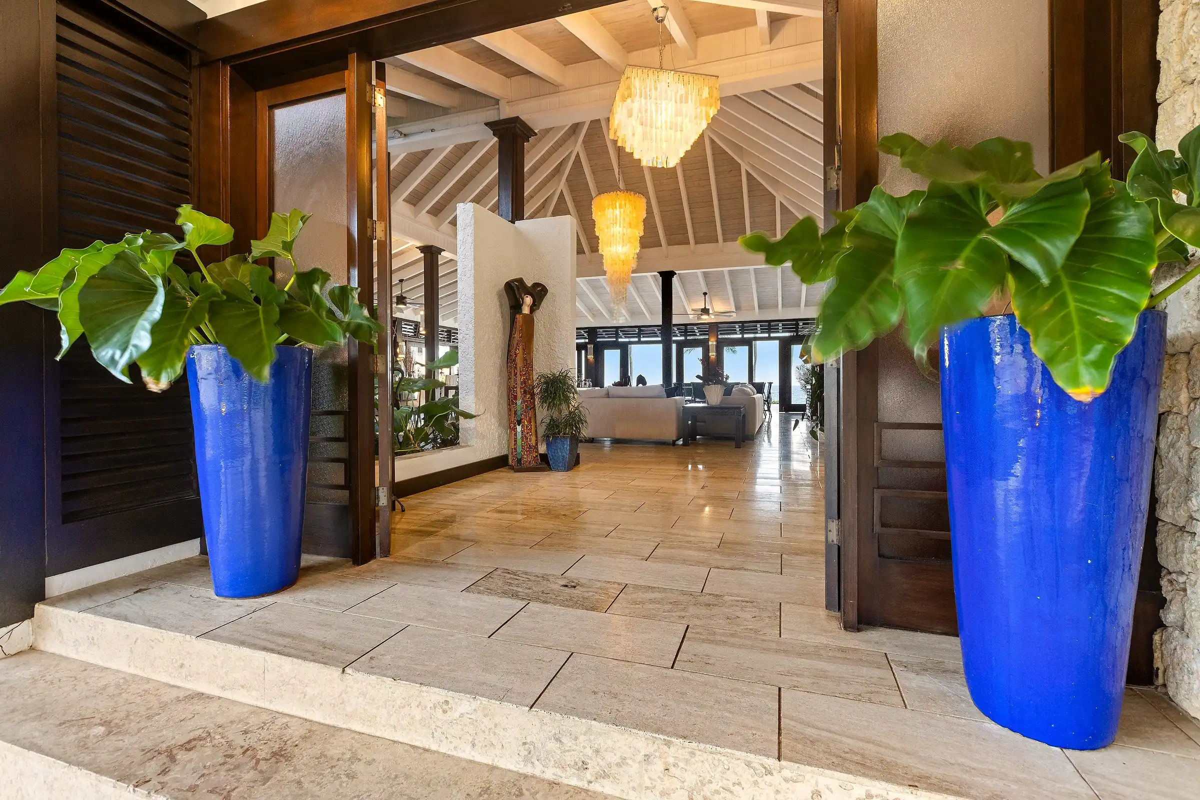 The entrance hall at Costa Verde 3, the sightline running straight through the house to the Caribbean