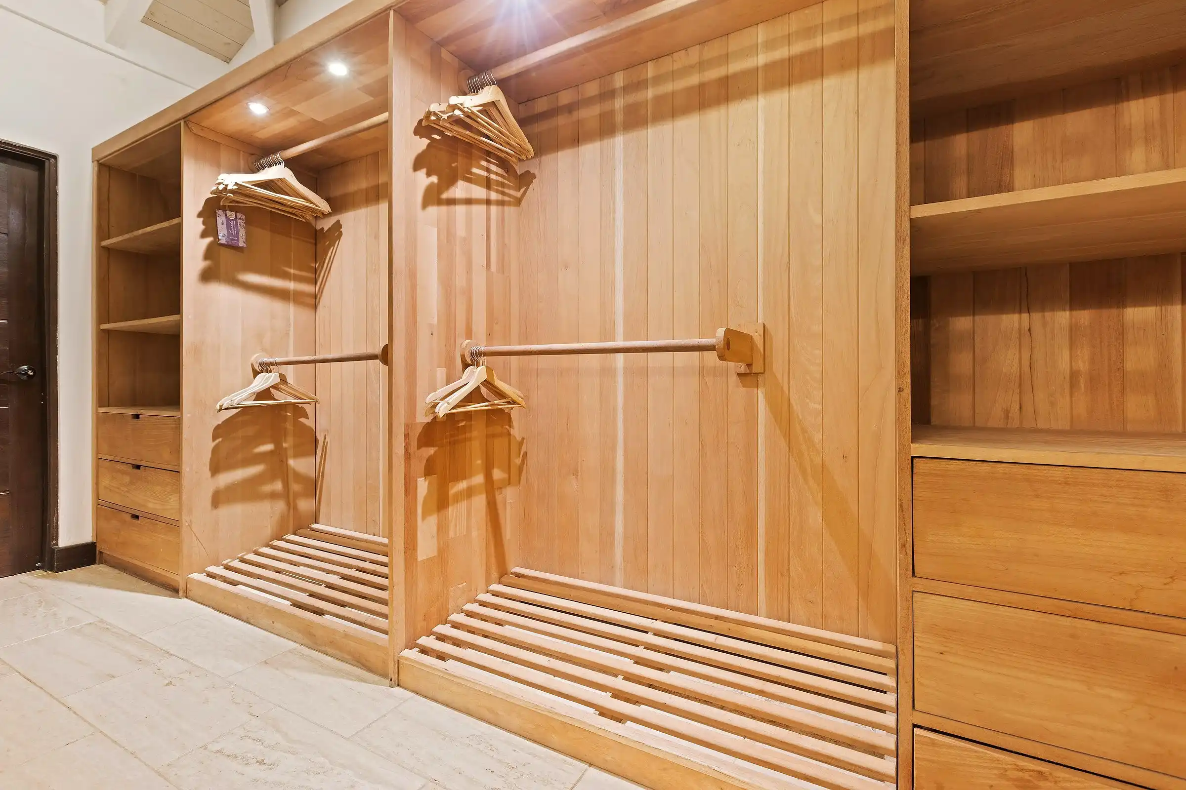 Fitted cedar dressing room at Costa Verde 3, hanging space and open shelving throughout