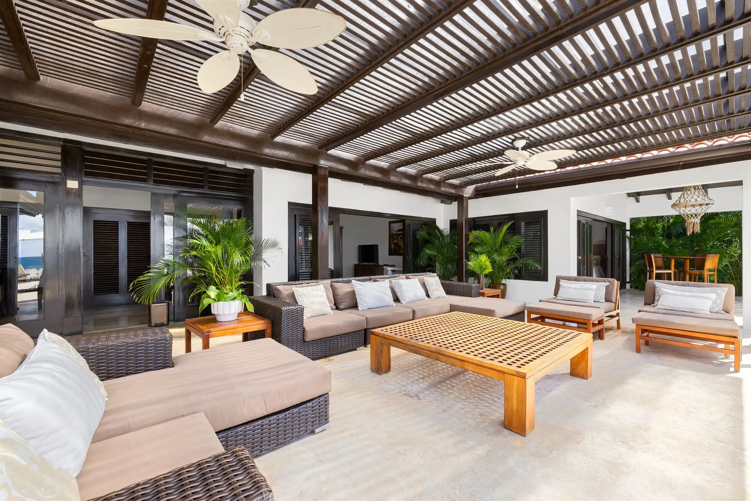 Seamless indoor–outdoor living at Costa Verde 3, the salon opening to the terrace and gardens